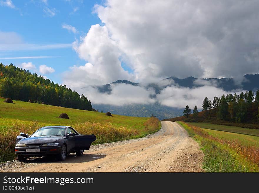 Car, Road And Skies.