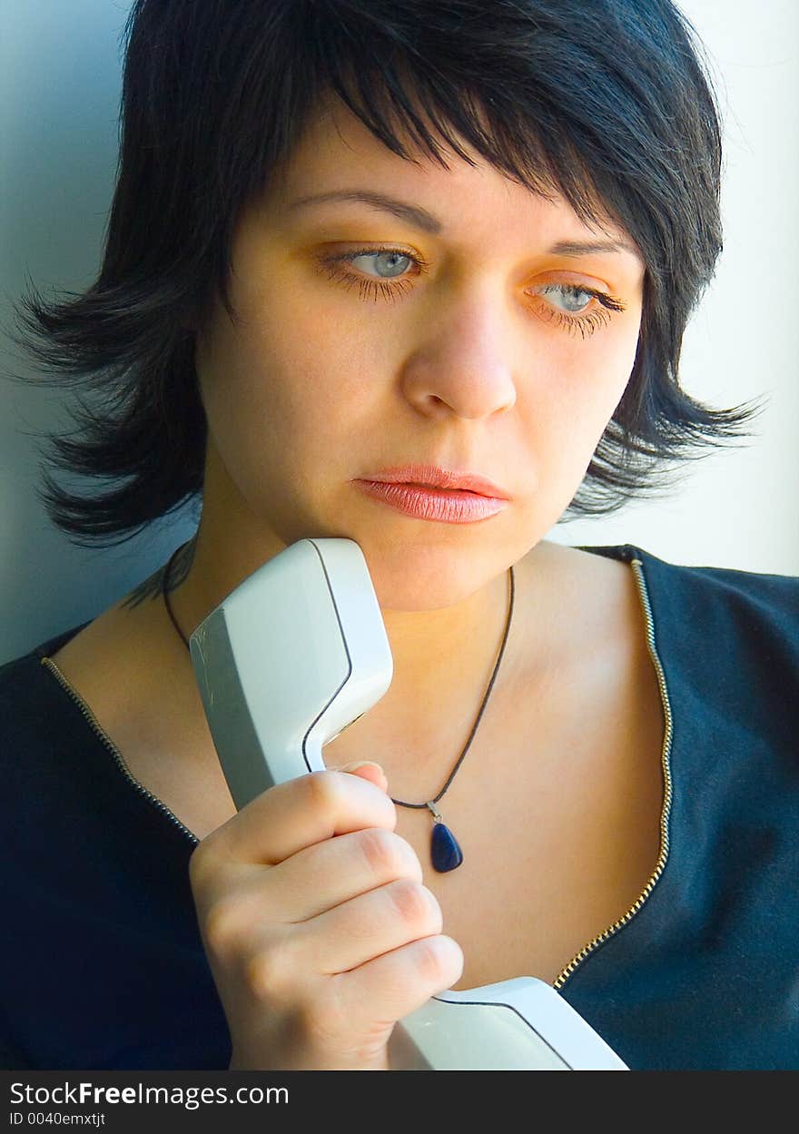 The thoughtful girl with phone. The thoughtful girl with phone