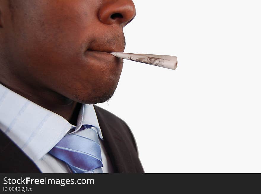 This is an image of a businessman with a 10 pound note in his lips. This is a metaphor for smoking money, wastage, business gamble etc.. (Please let me know where the image will be used by leaving a message in the Comments Section/See Portfolio)