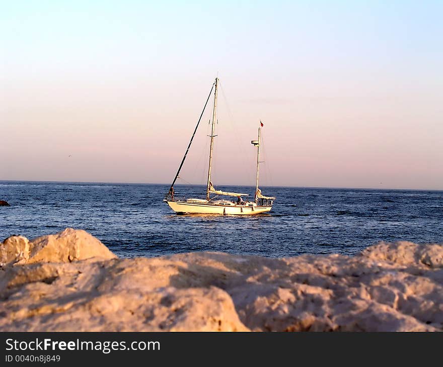 Small sailingboat at sea