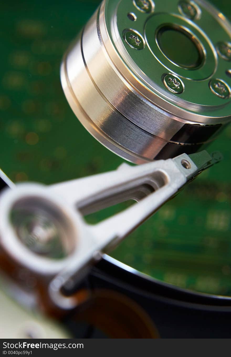 Hard disk with motherboard reflection, standing beside. Hard disk with motherboard reflection, standing beside