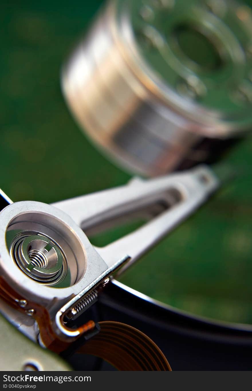 Hard disk with motherboard reflection, standing beside. Hard disk with motherboard reflection, standing beside