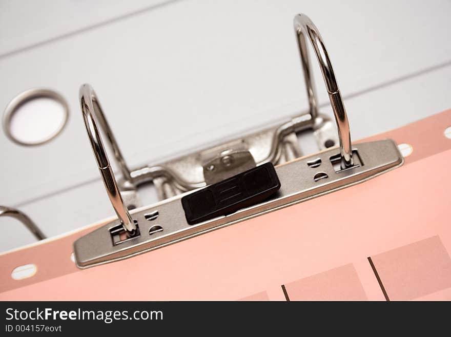 Close-up on an open arch lever file full of documents. Close-up on an open arch lever file full of documents.