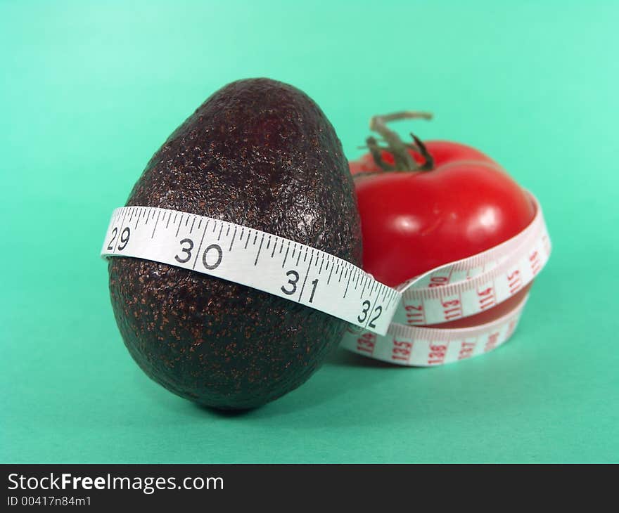 High resolution digital photo of an avocado, a tomato and a measuring tape symbolize healthy diet, cancer/disease prevention and body weight control. It is a “PRESCRIPTIONS FOR HEALTH”!. High resolution digital photo of an avocado, a tomato and a measuring tape symbolize healthy diet, cancer/disease prevention and body weight control. It is a “PRESCRIPTIONS FOR HEALTH”!