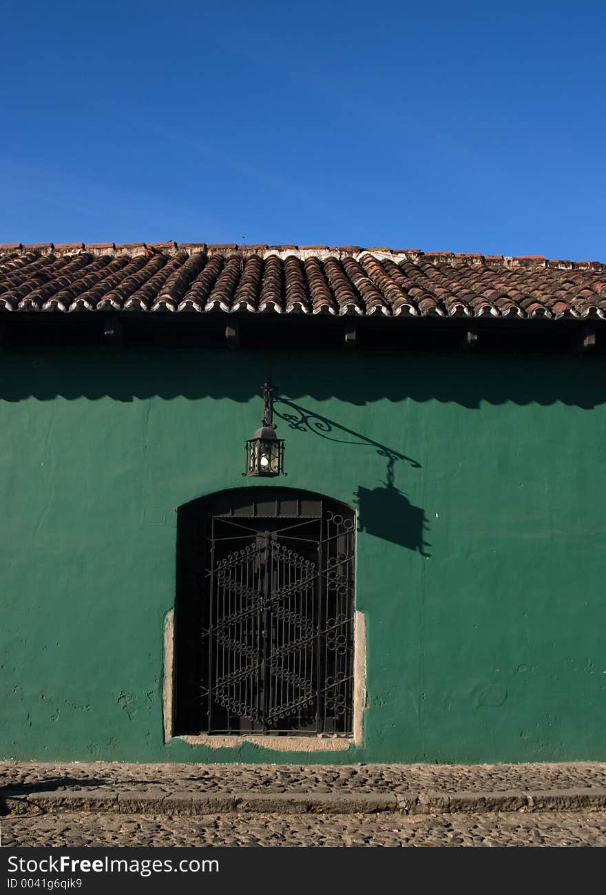 A home with a thatched roof, and a lamp out front in Antigua Guatemala. A home with a thatched roof, and a lamp out front in Antigua Guatemala