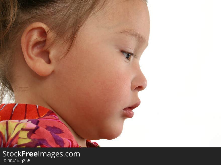 Profile of young Asian American girl. Shot in studio. Profile of young Asian American girl. Shot in studio.