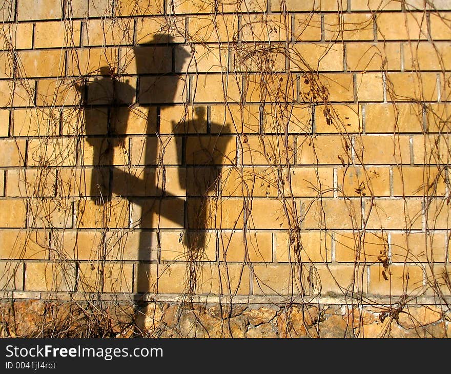 Shade of the old-time torch on brick wall. Shade of the old-time torch on brick wall