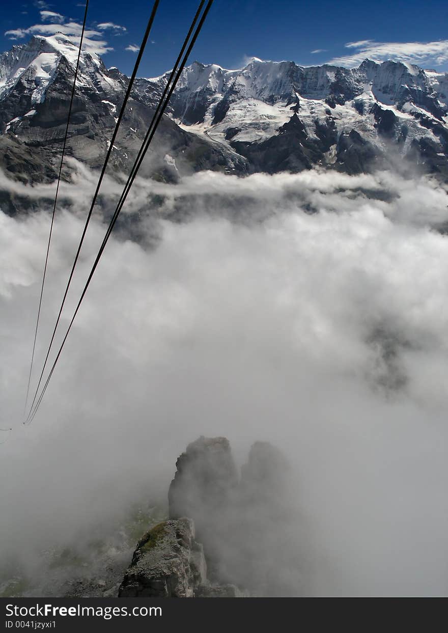 Alps With Mist And Cable Car