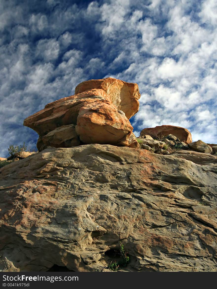 Blue sky above red rock