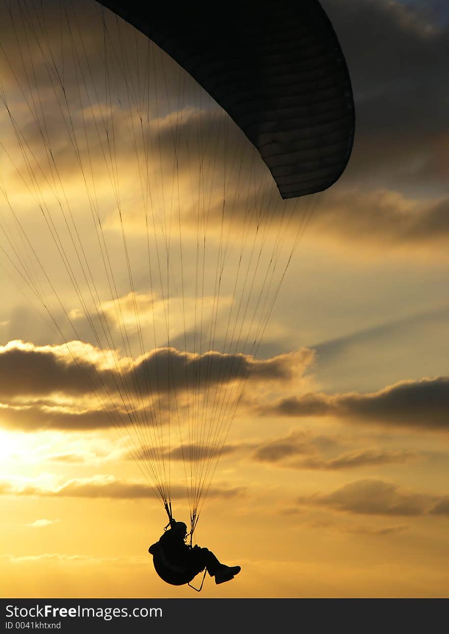 Hang glider over ocean sunset. Hang glider over ocean sunset