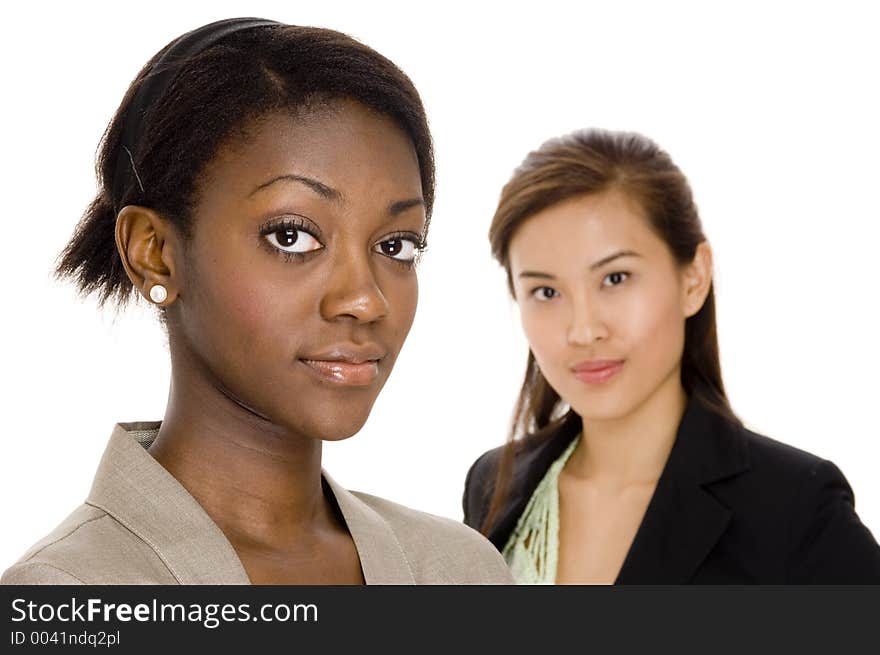 A young attractive businesswoman standing in front of a colleague. A young attractive businesswoman standing in front of a colleague