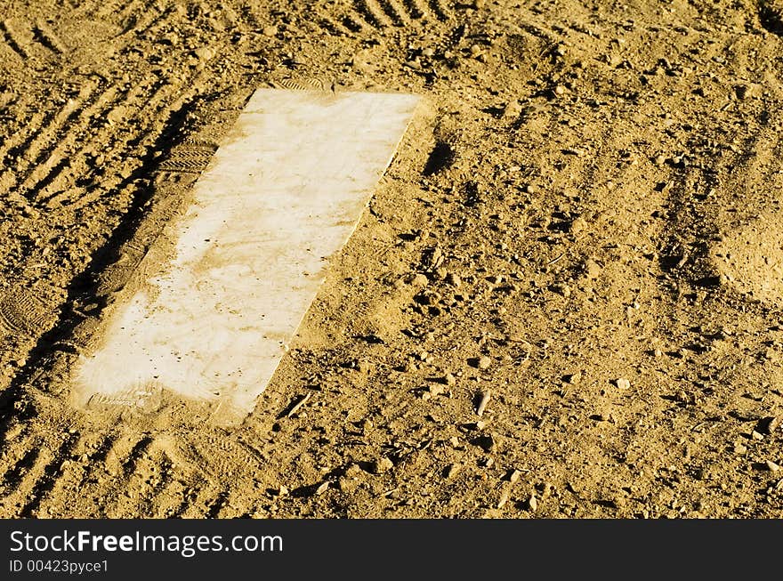 The pitcher's plate or rubber on a baseball field. The pitcher's plate or rubber on a baseball field