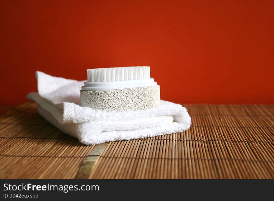 Pumice brush and towel at a spa - health and beauty