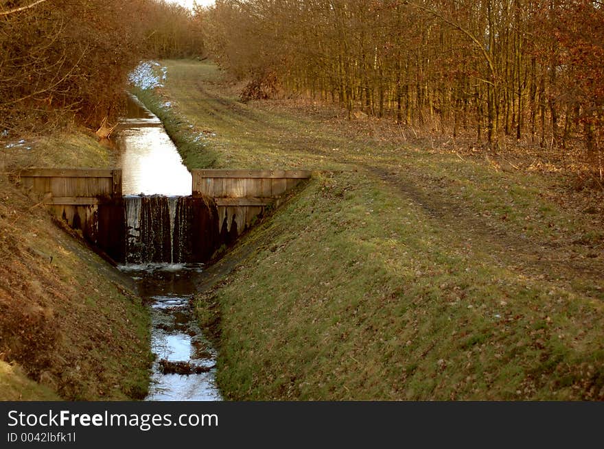 Small river with waterfall