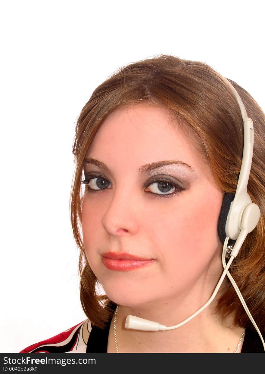 Attractive young woman with headset on white. Attractive young woman with headset on white