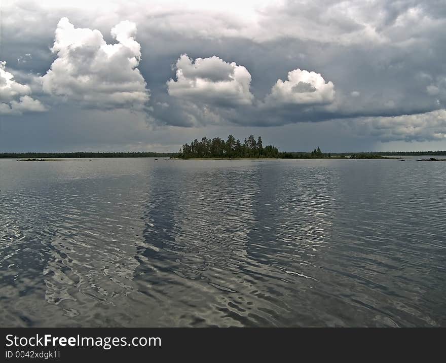 Water landscape with clouds and island