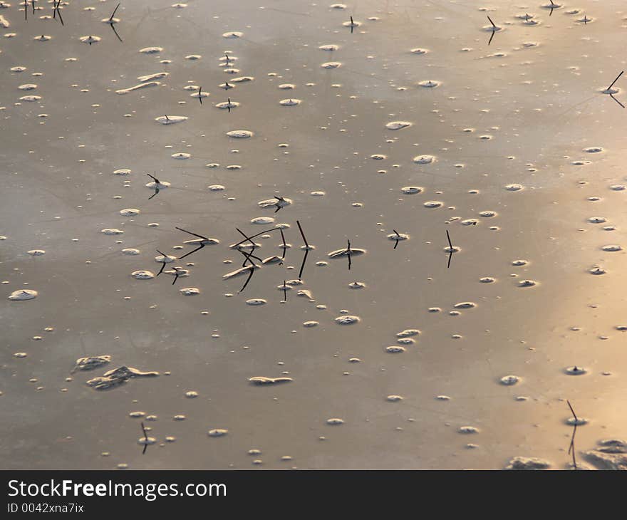 Sunset reflected in a frozen lake