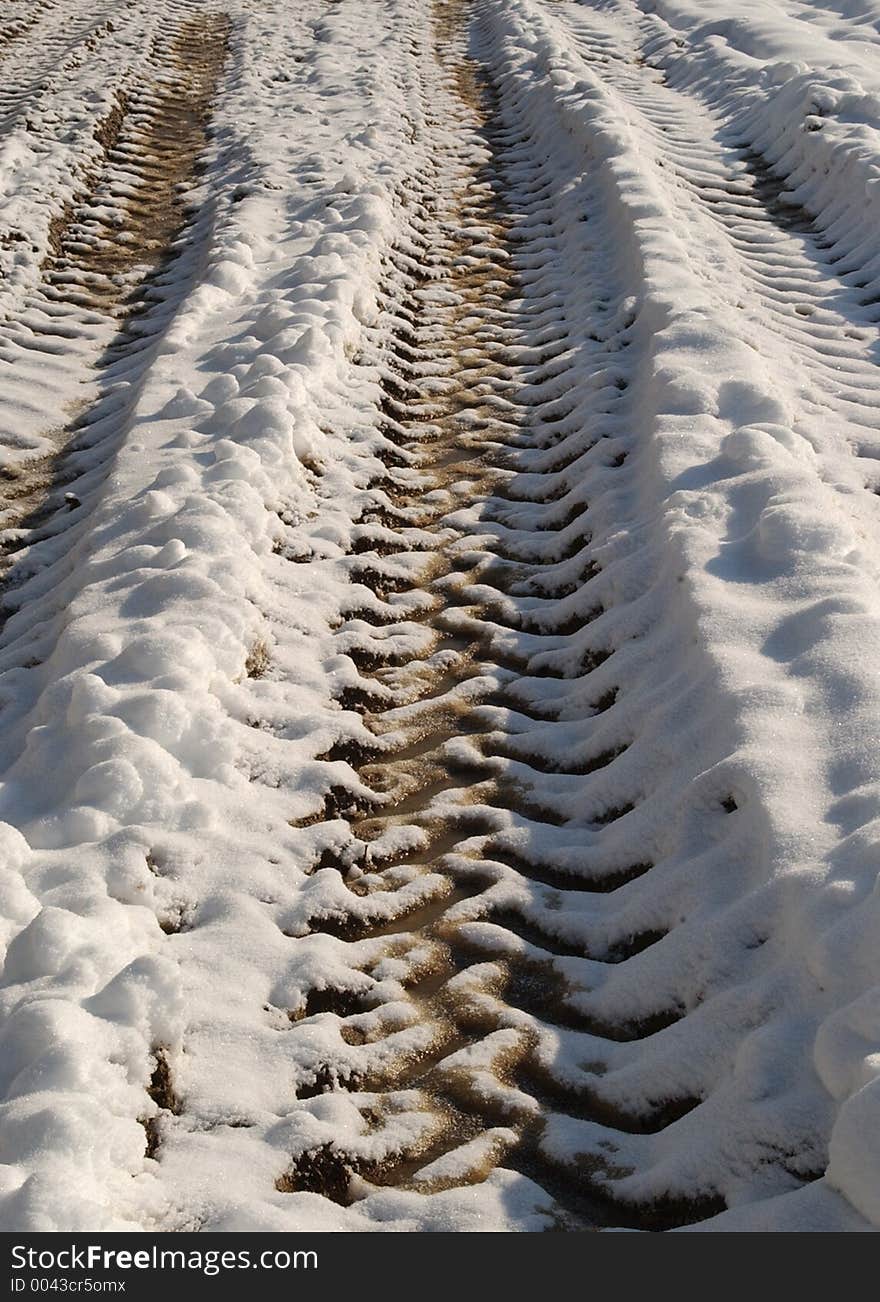 Tractor tyre tracks in the snow. Tractor tyre tracks in the snow