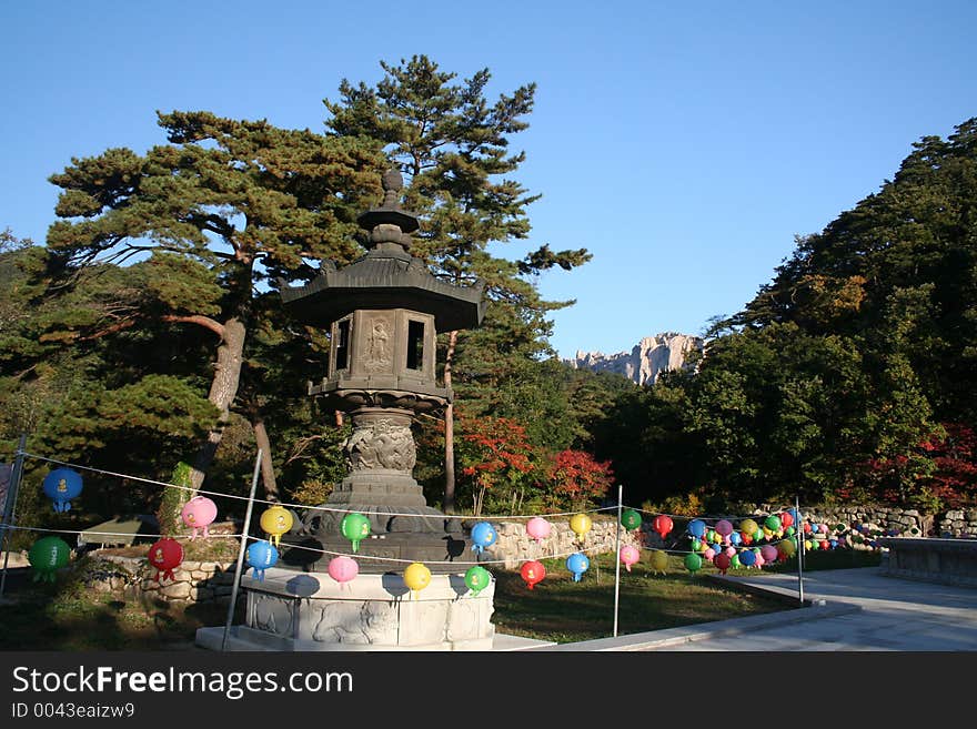 A path to a buddhist temple lined with chinese lanterns in south korea. A path to a buddhist temple lined with chinese lanterns in south korea.