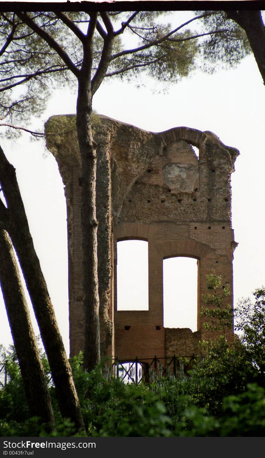 A part of a ruined wall with windows.