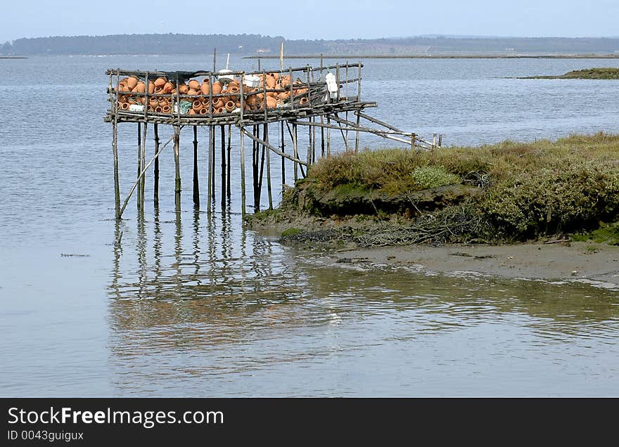 Fishermen equipment. Octopus traps at fishermen palaffite village. Estuary of Sado River, Carrasqueira, southern Portugal, E.U. Fishermen equipment. Octopus traps at fishermen palaffite village. Estuary of Sado River, Carrasqueira, southern Portugal, E.U.