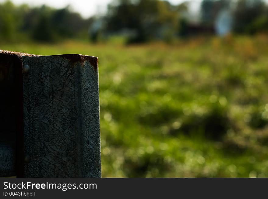 Galvanized metal fence in a country field. Galvanized metal fence in a country field