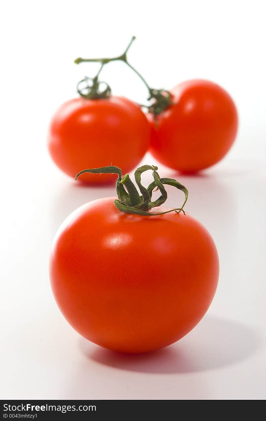 Studio work, group of tomatoes, artistic depth of field. Studio work, group of tomatoes, artistic depth of field