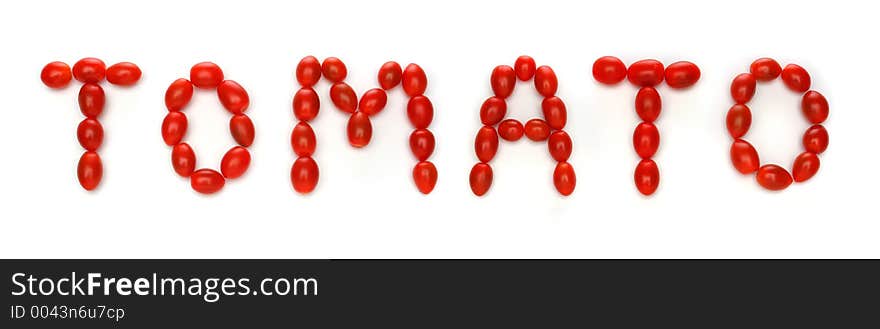 Word TOMATO written with cherry tomatoes. Look at my gallery for more fresh fruits and vegetables.