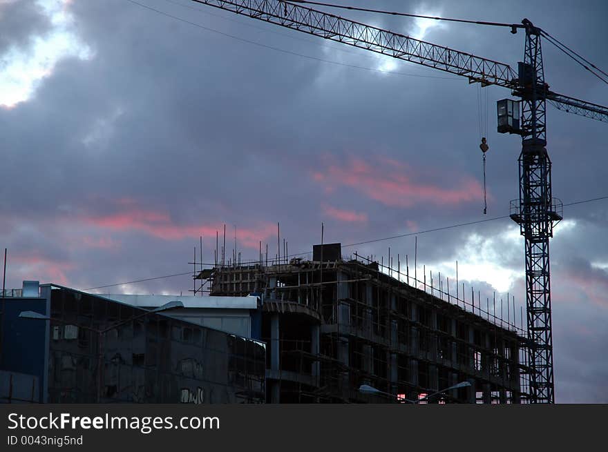 Crane and the unfinished building. Crane and the unfinished building