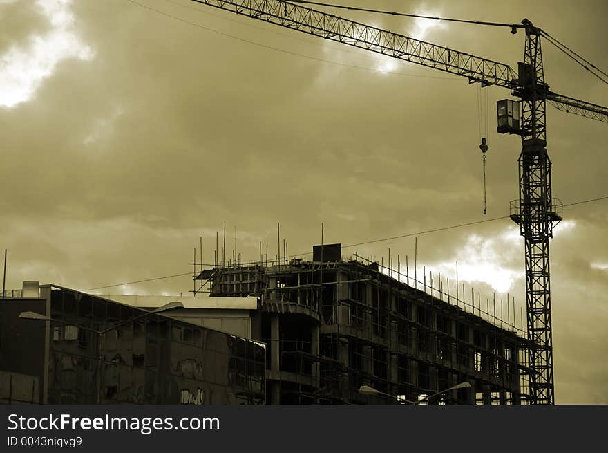 Crane and the unfinished building. Crane and the unfinished building