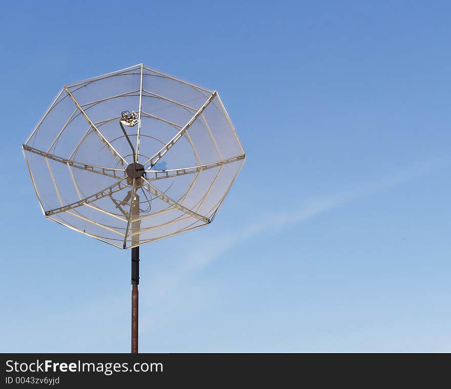 Satellite Dish against blue sky with room for text