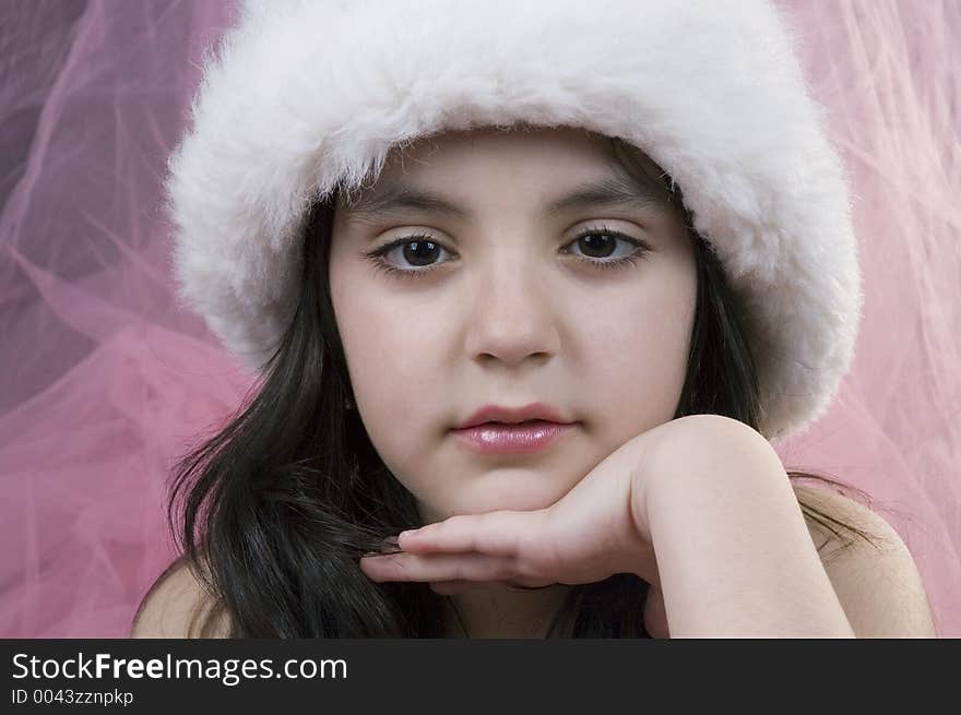 Pretty little girl with white hat and pink veil. Pretty little girl with white hat and pink veil