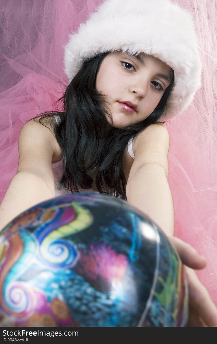 Pretty little girl with globe and white hat. Pretty little girl with globe and white hat