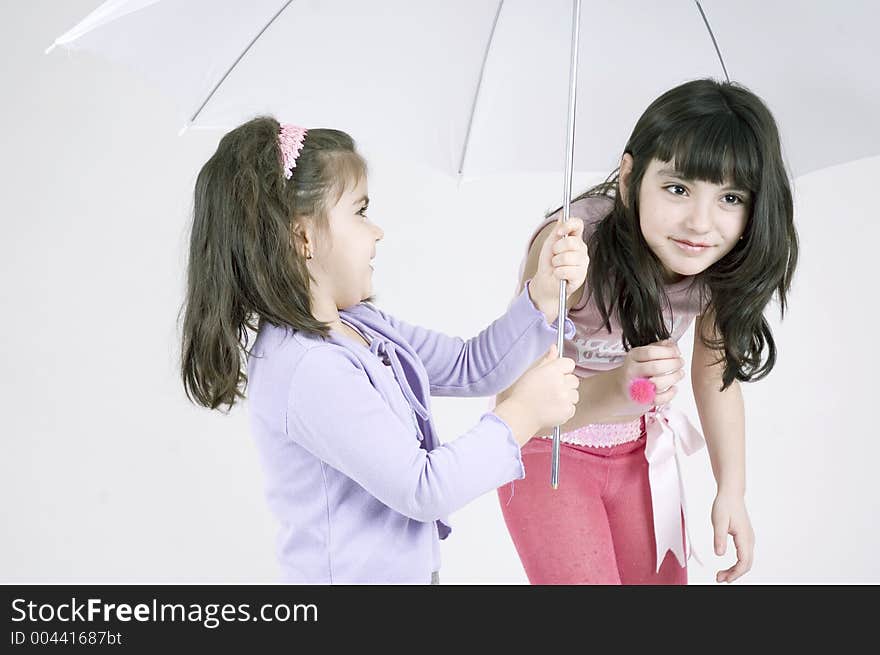 Two little girls and a white umbrella. Two little girls and a white umbrella