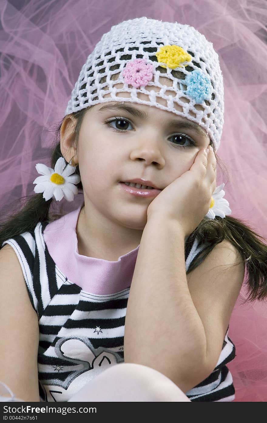 Little girl with daisies in her hair. Little girl with daisies in her hair