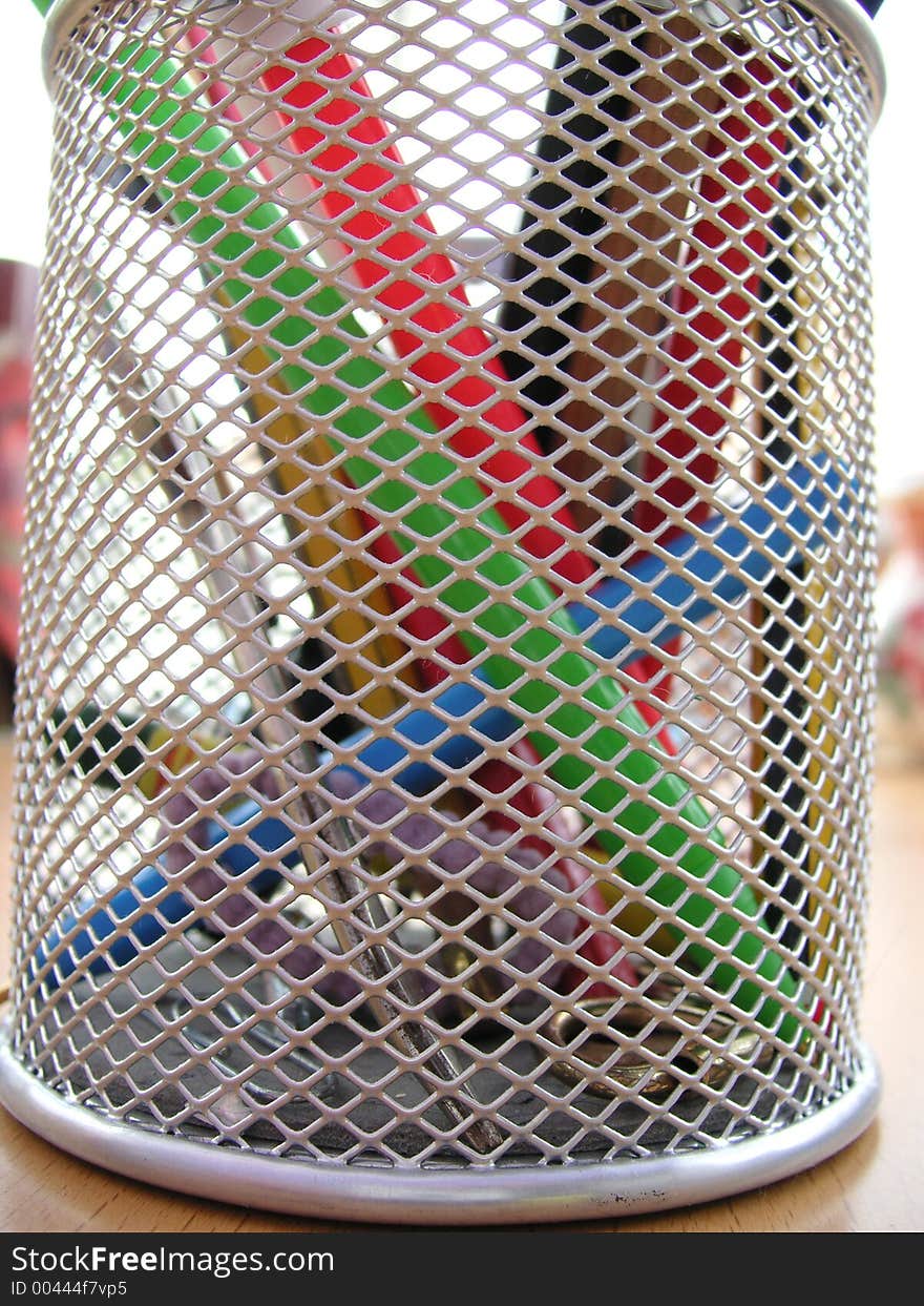 Mesh desktidy pot with pens and pencils in ti