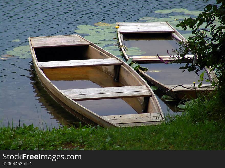 Two old boats on river