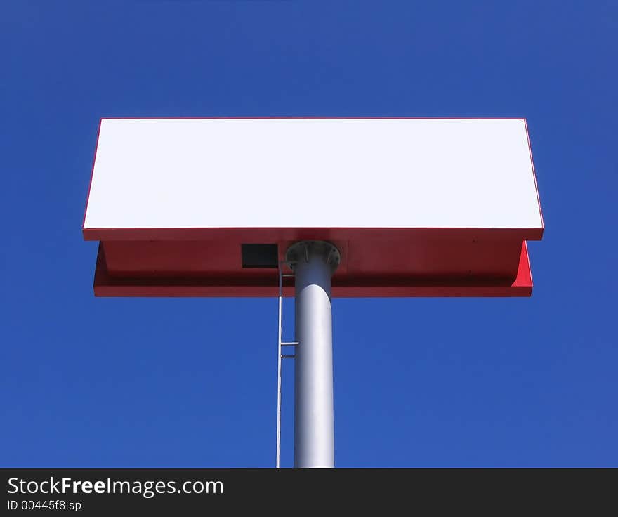 Blank billboard over blue sky