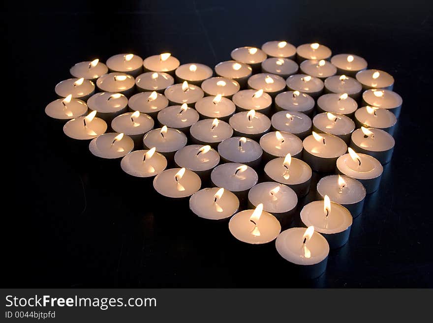 Group of Candles place in the shape of a heart. Group of Candles place in the shape of a heart