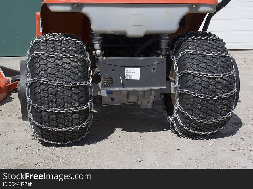 A set of chains on tractor tires. A set of chains on tractor tires