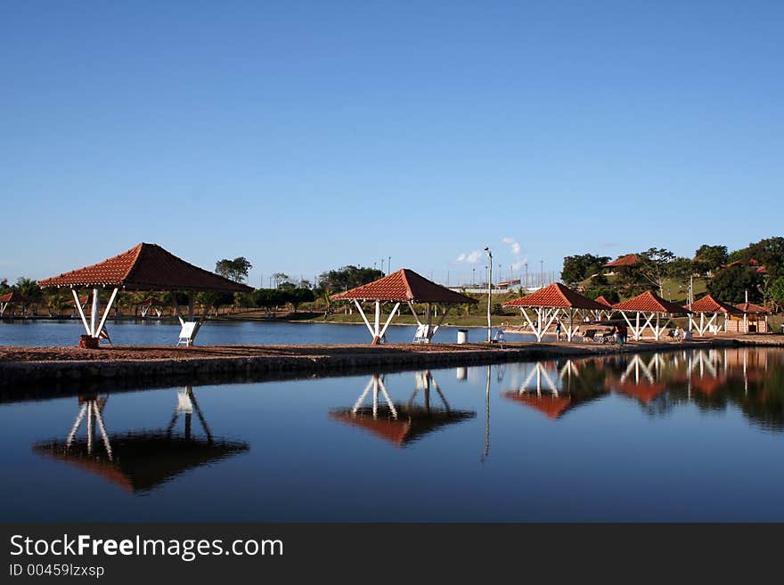 Kiosks reflection on a fishing & pay lakes. Kiosks reflection on a fishing & pay lakes.