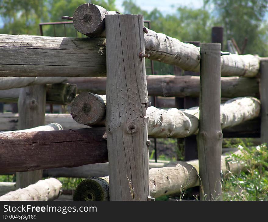 Wooden fence corner on a farm. Wooden fence corner on a farm