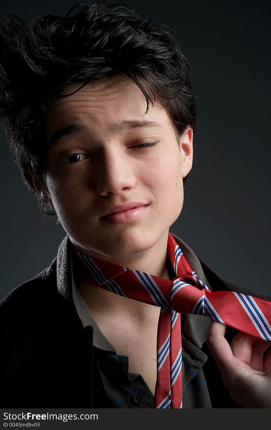 Young man on dark Background with red tie. Young man on dark Background with red tie