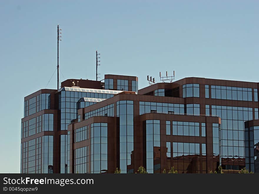 Brick and glass office tower against sky. Brick and glass office tower against sky