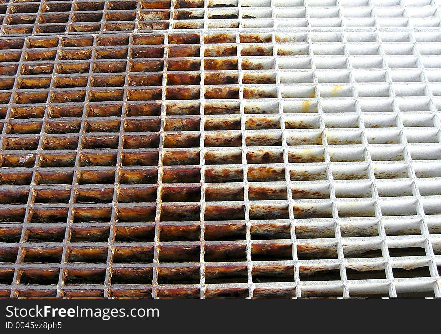 Rusty grid over water on a dock at Catalina Island, California