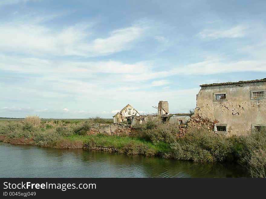 Ruins of old house and river