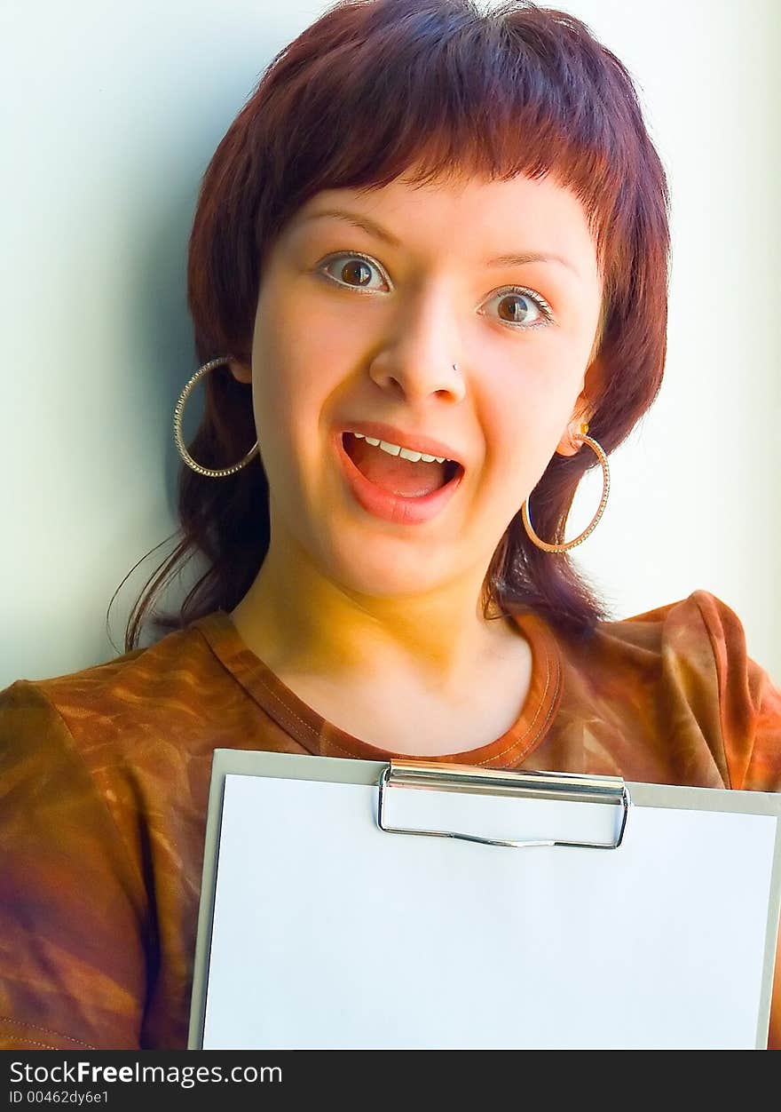 The girl holds a paper