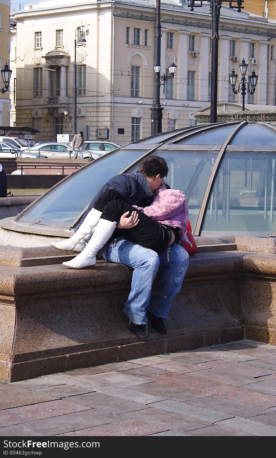 Girl kisses its friend on Manezhnaja Square in Moscow. Girl kisses its friend on Manezhnaja Square in Moscow