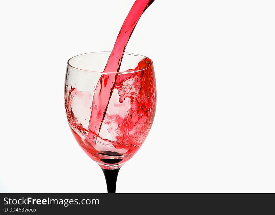 Red wine poured into a glass