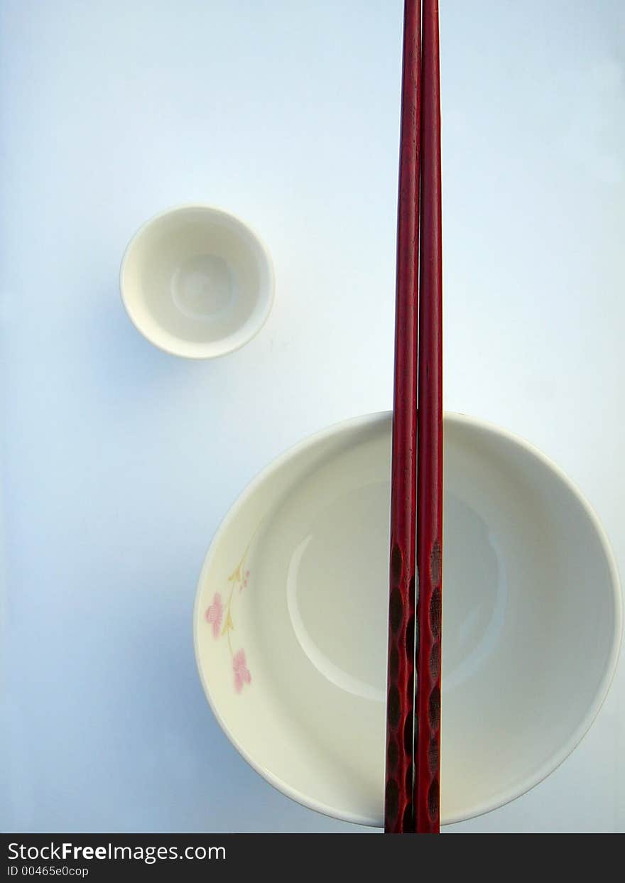 Chinese bowl, chopsticks and cup,in restrictive composition. Chinese bowl, chopsticks and cup,in restrictive composition